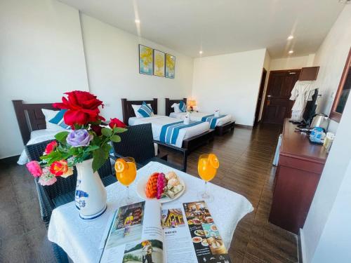 a hotel room with a table with a plate of food at VANG VIENG TOPVIEW HOTEL in Vang Vieng