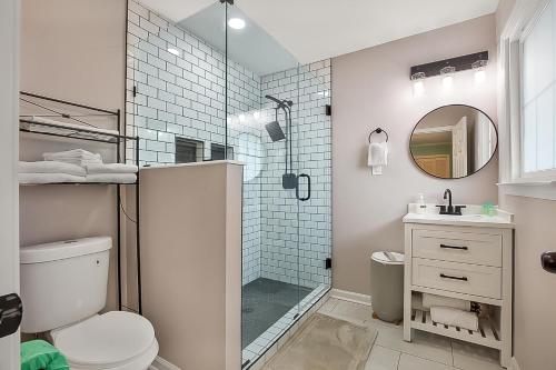 a bathroom with a shower and a toilet and a sink at A Shore Thing in North Myrtle Beach! 4 Bedroom Home! in Myrtle Beach