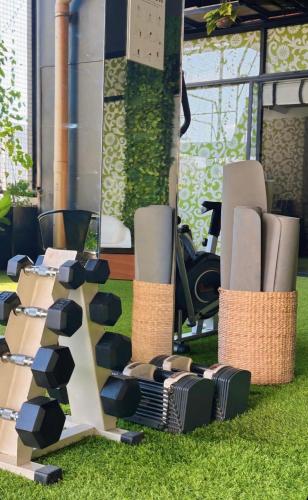 a display of wicker chairs on the grass at Azumi Boutique Hotel in Manila