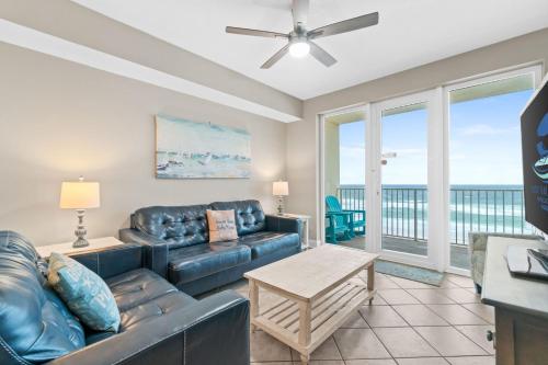 a living room with a couch and a table at Sea Dunes 502 Beach Oasis Beachfront Condo with Pool Hot Tub Free Beach Service 0488 in Fort Walton Beach