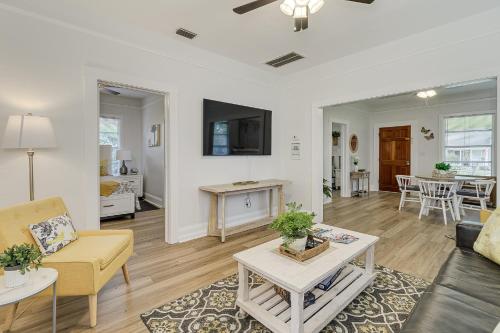 a living room with a couch and a table at Pennsylvania Bungalow - Historic Home in Downtown Lakeland in Lakeland