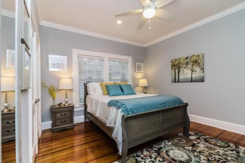a bedroom with a bed and a ceiling fan at The Osceola Historic District Charm - 10 Minute Walk to FSC & Downtown Lakeland in Lakeland