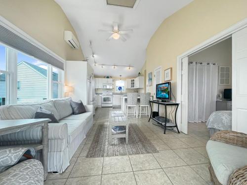 a living room with a couch and a table at Seascapes W153 Fantastic condo steps away from Wells Beach and town center 1900 in Wells