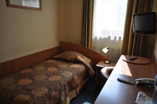 Телевизор и/или развлекательный центр в Matejko Hotel