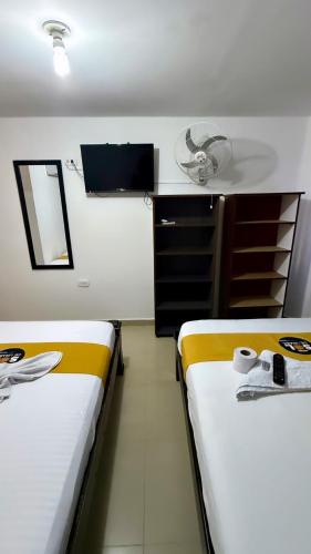 Un ou plusieurs lits dans un hébergement de l'établissement Hotel sol de uraba