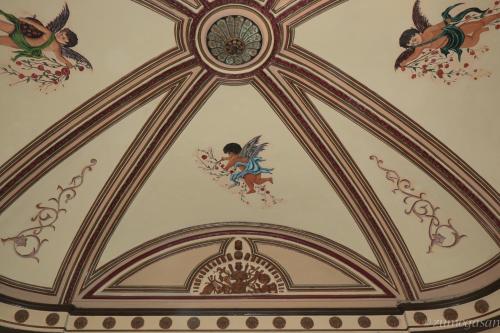 a room with a ceiling with paintings on it at Hostal Plaja i Pati de Can Plaja in Palafrugell