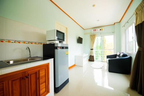 a kitchen with a sink and a counter top at PN Home Service @ Suvarnabhumi Airport in Lat Krabang