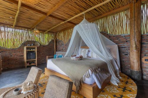 Кровать или кровати в номере Shigar Livin Bali