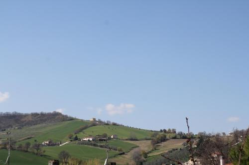 a view of a hill with houses on it at Anna Rita B&B in Moie