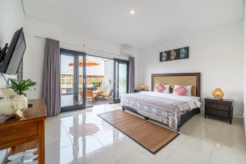 a bedroom with a bed and a balcony at Sunbeji - Relax and Unwind - Seminyak Luxury Stay with Private Pool in Seminyak