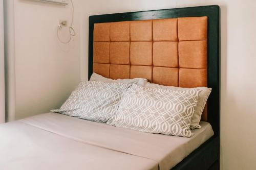 En eller flere senge i et værelse på City Haven with Prime Views