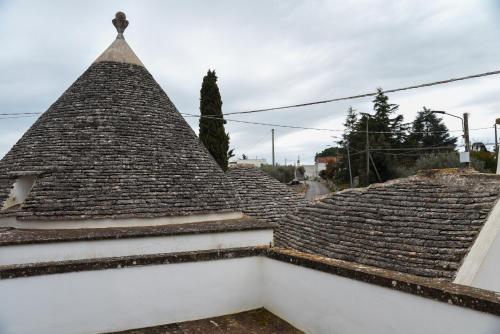 a roof of a building with tiles on it at Dimora Maseva - DIEMME STAY in Alberobello