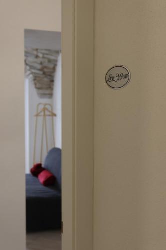 a door with a sign on it in a room at Il Viandante Bed & Breakfast in Roseto Valfortore