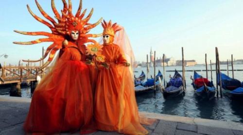 two people dressed in costumes standing next to a marina at Comfortable house - garden and parking in Farra di Soligo