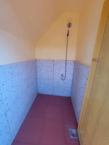 a small room with a shower with a purple floor at Top View Kohrong in Koh Rong