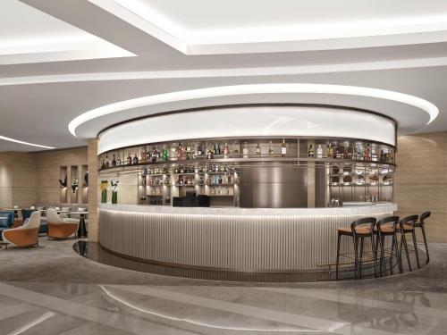 a rendering of a bar in a hotel lobby at Cordis, Foshan, Lingnan Tiandi - Free Shuttle Bus to Canton Fair in Foshan