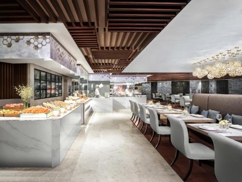 a rendering of a restaurant with tables and chairs at Cordis, Foshan, Lingnan Tiandi - Free Shuttle Bus to Canton Fair in Foshan