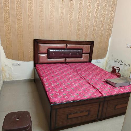 a bed in a room with a pink mattress at City heart in Kharar