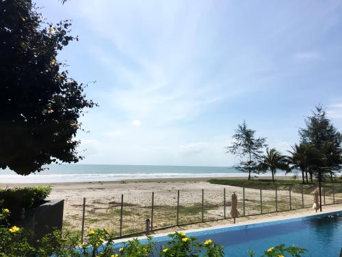 a view of a beach and a swimming pool at TimurBay Seafront Residence Kuantan in Kuantan
