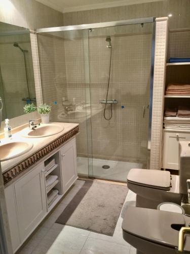 a bathroom with a shower and a toilet and a sink at CABALLITO DE MAR (SEAHORSE) in Playa Blanca