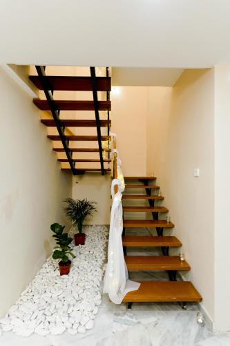 a bride walking down the stairs in a house at Duke Oasis in Kuala Lumpur