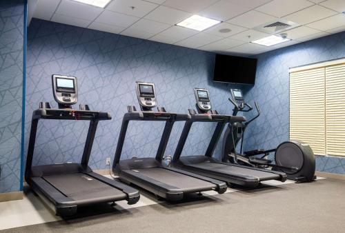 a gym with five exercise bikes and cell phones at Homewood Suites - Doylestown in Warrington