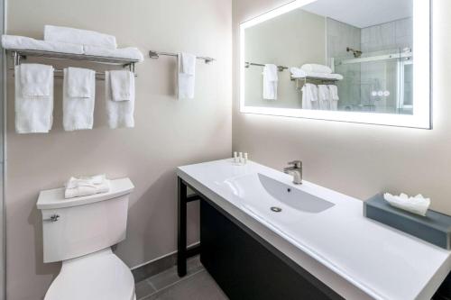 a white bathroom with a sink and a mirror at La Quinta Inn by Wyndham Steamboat Springs in Steamboat Springs