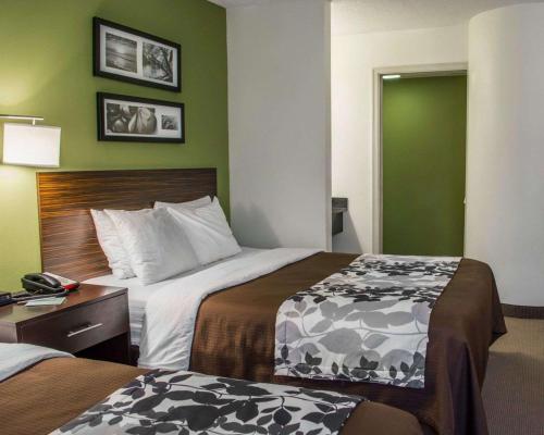 Ένα ή περισσότερα κρεβάτια σε δωμάτιο στο Sleep Inn Historic