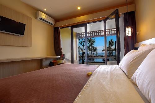 Ένα ή περισσότερα κρεβάτια σε δωμάτιο στο Sunset House Gili Meno