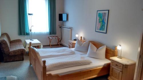 Un pat sau paturi într-o cameră la Hotel Unterwirt