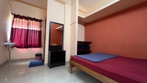 Postel nebo postele na pokoji v ubytování Hi5 Holiday Apartments - Udupi