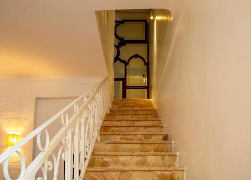 a staircase leading up to a door in a house at Charming 5 bedroom in Marrakech