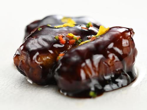 a chocolate covered donut with chocolate sauce and sprinkles at 厳美渓温泉いつくし園 in Itsukushi