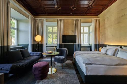 Postel nebo postele na pokoji v ubytování A-ROSA Collection Straubinger Grand Hotel Bad Gastein