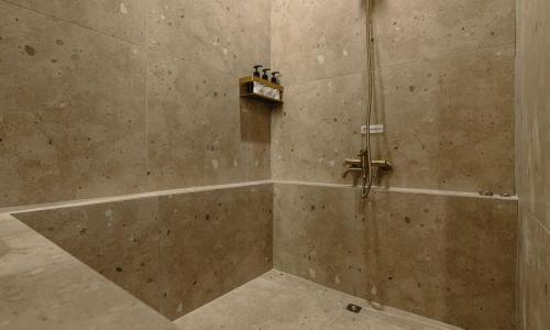 a bathroom with a shower with at Hound Hotel chuncheon in Chuncheon