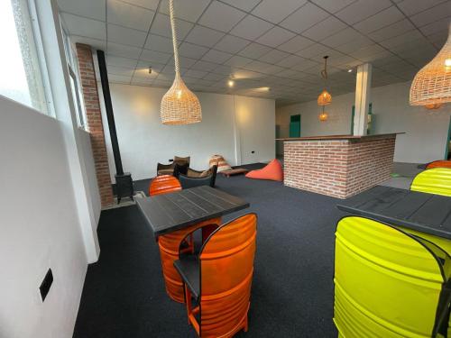 a meeting room with tables and chairs in a building at Journey Junction Hostel in Nuwara Eliya