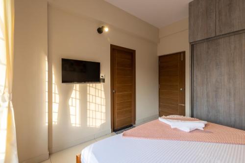 Katil atau katil-katil dalam bilik di Olive Service Apartments - Koramangala