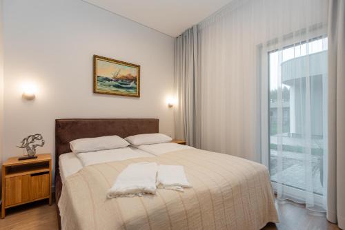 Ένα ή περισσότερα κρεβάτια σε δωμάτιο στο Vila Barbora 2