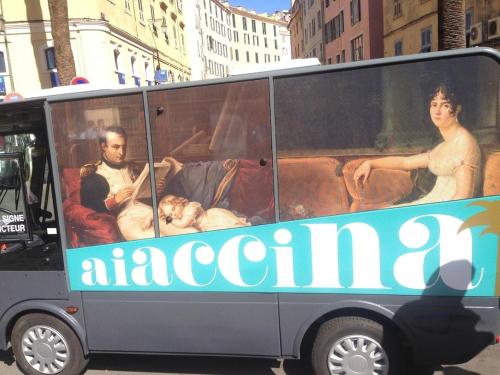a bus with people sitting in the back of it at Loft Place du Diamant Hyper centre ville Plage 50m in Ajaccio