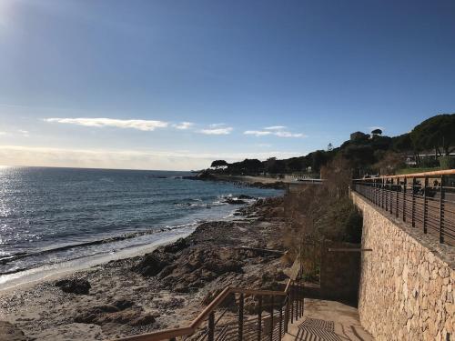 a view of a beach with the ocean at Loft Place du Diamant Hyper centre ville Plage 50m in Ajaccio