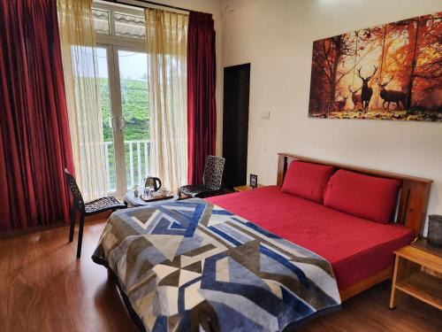 a bedroom with a bed and a large window at Cloud & Mist Inn-Stay with Mountain Views in Kotagiri, Near Ooty in Kotagiri