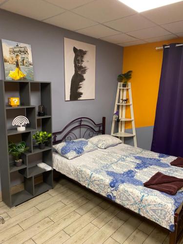 a bedroom with a bed and a ladder in it at Hostel Meridian in Kyiv