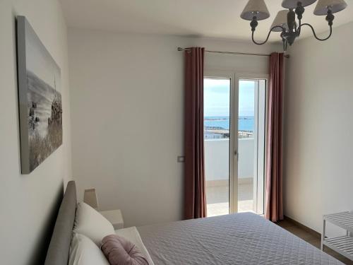 Ένα ή περισσότερα κρεβάτια σε δωμάτιο στο AGM Suite Fiumicino Airport Faro 15