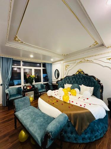 a bedroom with a large bed with fruit on it at Aloha Hotel in Hanoi
