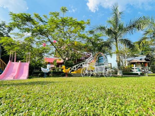 a park with a slide and a playground at Rangauti Resort in Binesri