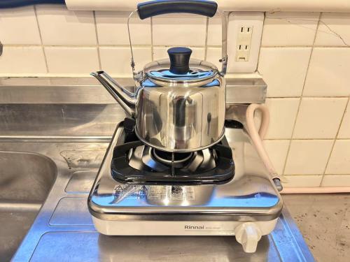 a tea pot sitting on top of a stove at Y-Shinjuku City, Okubo 5F-SJ0070 in Tokyo