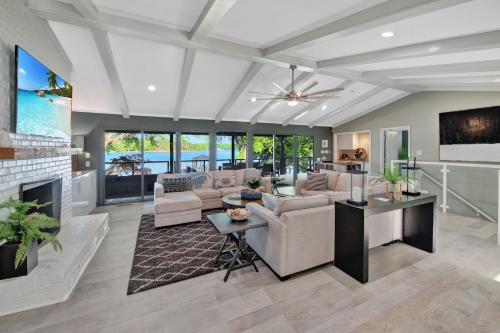 a living room with a couch and a fireplace at Southern Sunrise Covered Dock & Optional Boat Rental in Mooresville