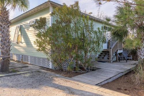 a house with a wooden porch with a deck at The Rookery III 5008 cottage in Gulf Shores