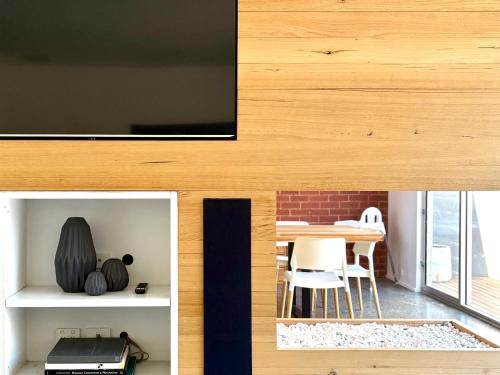 a room with a table and a dining room at The Bowden Hideaway I City Fringe I Sleeps 10 I Free Parking I Walk to Cafe's in Bowden