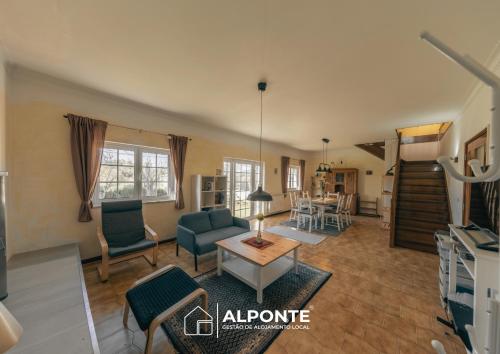a living room with a couch and a table at Casa da Melanie in Caminha
